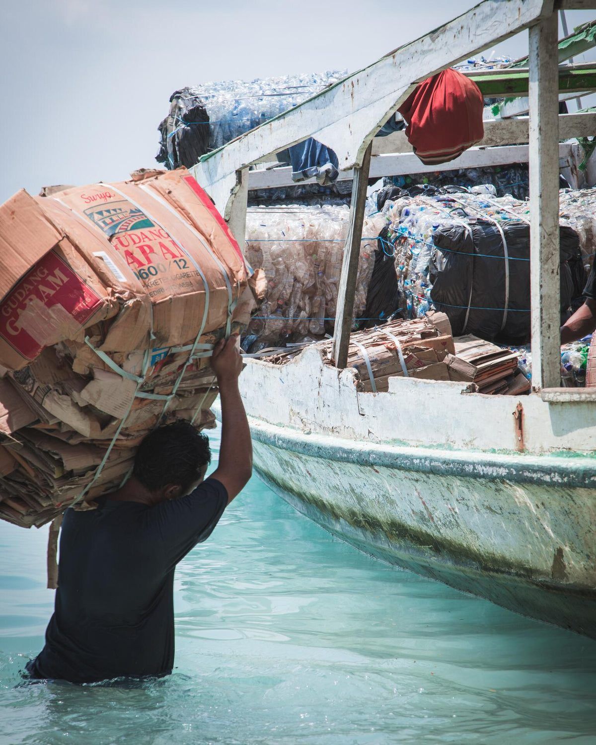 Loading baled material for transport to the mainland