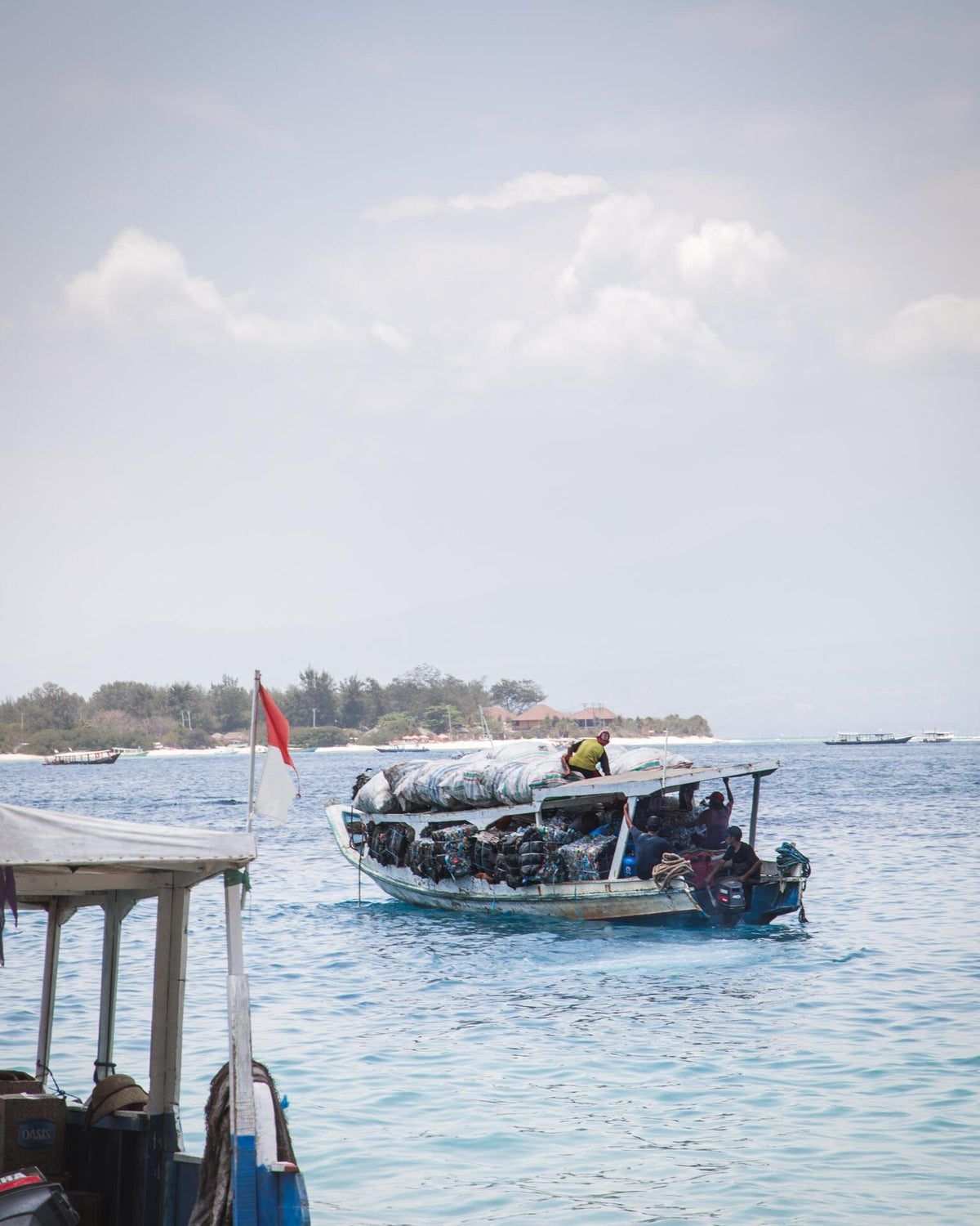 Island collection boat carrying baled plastic, Gili Islands