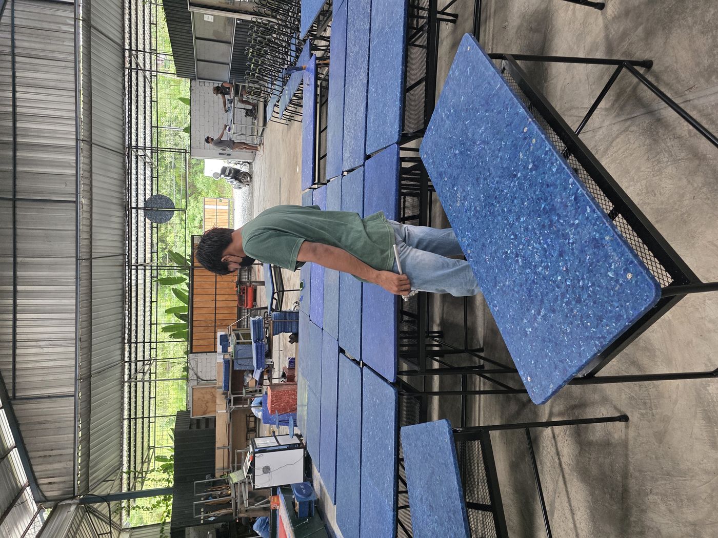 School desks in assembly — 100% recovered plastic tops